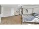 A spacious main bedroom with a king bed, dresser and bright windows at 6817 Osprey Landing Dr, Wendell, NC 27591