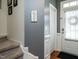 Bright entryway featuring hardwood floors and staircase at 700 Treviso Ln, Apex, NC 27502