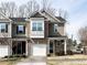 Charming townhouse featuring a brick facade and a one-car garage at 700 Treviso Ln, Apex, NC 27502