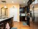 Spacious kitchen with stainless appliances, granite counters and wood floors at 700 Treviso Ln, Apex, NC 27502