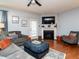 Open-concept living room showcasing a fireplace and comfortable seating area at 700 Treviso Ln, Apex, NC 27502