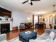 Inviting living room with hardwood floors and open floor plan to dining area at 700 Treviso Ln, Apex, NC 27502
