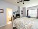 Tranquil main bedroom with a king bed, tv and attached en-suite bathroom at 700 Treviso Ln, Apex, NC 27502