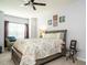 Relaxing primary bedroom with patterned bedding, soft lighting, and a cozy atmosphere at 700 Treviso Ln, Apex, NC 27502