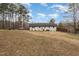 Expansive backyard featuring a well-maintained lawn and mature trees at 703 Sybil Dr, Durham, NC 27703