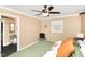 Bedroom featuring neutral walls, a ceiling fan, and access to a walk-in closet at 703 Sybil Dr, Durham, NC 27703