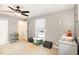 Bedroom with neutral paint, a ceiling fan, and decoratively framed artwork at 703 Sybil Dr, Durham, NC 27703