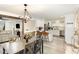 Open concept showcases modern dining area leading to a well-equipped kitchen, perfect for entertaining at 703 Sybil Dr, Durham, NC 27703