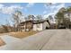 Exterior elevation of a well-maintained home with a driveway and landscaping at 703 Sybil Dr, Durham, NC 27703