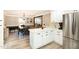Spacious kitchen island that offers a scenic view of an elegant dining room at 703 Sybil Dr, Durham, NC 27703
