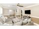 Comfortable living room with a gray couch, large ottoman, and neutral color scheme at 703 Sybil Dr, Durham, NC 27703
