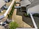 Aerial view of a backyard featuring a lawn, screened porch, and a privacy fence lined with evergreen trees at 78 Radcliffe Ct, Clayton, NC 27527