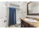 Bathroom featuring single sink vanity, tile floors and shower with curtain at 78 Radcliffe Ct, Clayton, NC 27527