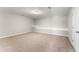 Spacious carpeted bedroom with neutral walls, large window, and ample natural light at 78 Radcliffe Ct, Clayton, NC 27527