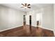 Bedroom with hardwood floors, ceiling fan, and a view to a bathroom and closet at 78 Radcliffe Ct, Clayton, NC 27527