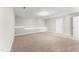 Spacious carpeted bedroom with neutral walls, large window, and ample natural light at 78 Radcliffe Ct, Clayton, NC 27527