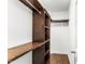 A walk-in closet with custom shelving and hardwood floors at 78 Radcliffe Ct, Clayton, NC 27527