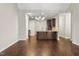 Open-concept dining and kitchen area with hardwood floors and modern chandelier at 78 Radcliffe Ct, Clayton, NC 27527