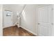 Inviting entryway with rich hardwood flooring, natural light, and a glimpse of the staircase leading to the upper level at 78 Radcliffe Ct, Clayton, NC 27527