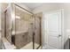 Tiled shower with glass enclosure and built in grab bar for accessibility at 78 Radcliffe Ct, Clayton, NC 27527