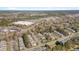 This aerial view features nearby shopping centers, restaurants, and a pond at 7920 Leonardo Dr, Durham, NC 27713