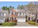 Charming two-story home with brick and siding, well-manicured lawn, and two car garage at 7920 Leonardo Dr, Durham, NC 27713
