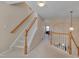 Well-lit hallway with carpeted stairs and views into several rooms at 7920 Leonardo Dr, Durham, NC 27713