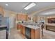 Modern kitchen features breakfast bar, ample countertop space, and open to the living area at 7920 Leonardo Dr, Durham, NC 27713