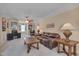 Relaxing living room with leather sofa and wood furniture and decor at 7920 Leonardo Dr, Durham, NC 27713