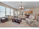 Inviting living room with plush furniture, an open layout, and ample natural light at 7920 Leonardo Dr, Durham, NC 27713