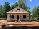 Exterior view of new home construction featuring WILD Stay Wild weather-resistant barrier and wooded surroundings at 87 Legolas Ct, Middlesex, NC 27557
