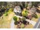 Beautiful home from an aerial view features a long driveway and lush landscaping on a large lot at 913 Clayton Rd, Angier, NC 27501