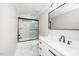 This bathroom offers a dual sink vanity, shower with glass doors, and modern fixtures at 913 Clayton Rd, Angier, NC 27501