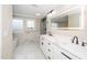 This bathroom offers double sinks, a marble backsplash, and a sleek walk-in shower at 913 Clayton Rd, Angier, NC 27501
