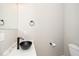 This half bathroom offers a stylish black vessel sink with a sleek black faucet at 913 Clayton Rd, Angier, NC 27501