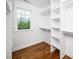This walk-in closet features built in shelving for easy storage and organization at 913 Clayton Rd, Angier, NC 27501