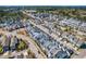 Aerial view of a vibrant neighborhood with tree-lined streets and well-maintained homes at 966 Shoofly Path, Apex, NC 27502