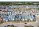 Birds eye view of a planned community with a mix of home styles, tree-lined streets, and manicured lawns at 966 Shoofly Path, Apex, NC 27502
