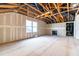 Unfinished bonus room featuring a window, wood framing, and space for personalization to make it your own at 966 Shoofly Path, Apex, NC 27502