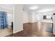 View of an open-concept layout showcasing the bathroom, living area, and kitchen at 966 Shoofly Path, Apex, NC 27502