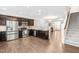 Open kitchen flows into living area with stainless appliances and granite countertops at 966 Shoofly Path, Apex, NC 27502
