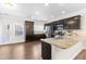 Bright kitchen with stainless appliances, granite countertops, and access to the backyard at 966 Shoofly Path, Apex, NC 27502