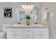 Bright bathroom with double vanity, decorative mirrors, and modern fixtures at 100 Pebble Ridge Farms Ct, Cary, NC 27513