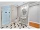 Stylish bathroom featuring a glass enclosed shower, patterned floor tiles, and an elegant sink at 100 Pebble Ridge Farms Ct, Cary, NC 27513