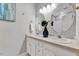 Bathroom featuring double vanity sinks, neutral color scheme, and well-lit mirrors at 100 Pebble Ridge Farms Ct, Cary, NC 27513