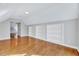 Bright bedroom with hardwood floors, built-in shelving, and fresh paint at 100 Pebble Ridge Farms Ct, Cary, NC 27513