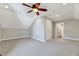 Neutral bedroom featuring plush carpeting, a ceiling fan, and a large closet with double doors at 100 Pebble Ridge Farms Ct, Cary, NC 27513