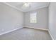 Empty bedroom featuring a window and neutral walls at 100 Pebble Ridge Farms Ct, Cary, NC 27513