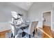 Bright dining room with modern chandelier, light gray walls, and hardwood flooring at 100 Pebble Ridge Farms Ct, Cary, NC 27513