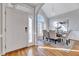 Elegant dining area features stylish lighting, large windows, and hardwood floors at 100 Pebble Ridge Farms Ct, Cary, NC 27513